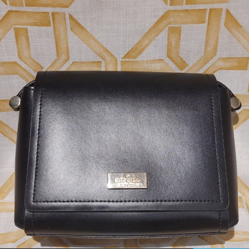 Black Kate Spade crossover bag with magnetic clasp